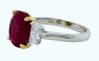 Platinum and 18kt yellow gold cushion ruby and half moon diamond ring