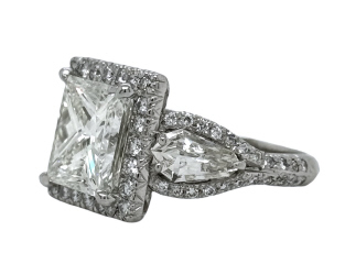 Platinum princess cut diamond halo and kite 3-stone ring