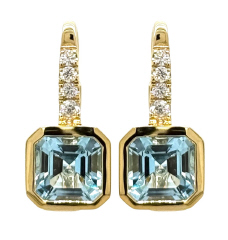 14kt yellow gold bezel set blue topaz and diamond earrings