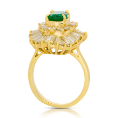 18kt yellow gold oval emerald, round and baguette diamond ring