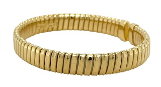 18kt yellow gold flexible cuff bangle bracelet.