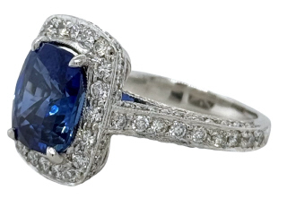 Platinum cushion sapphire and diamond halo ring