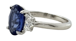 Platinum oval sapphire and half moon diamond ring