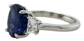 Platinum oval sapphire and traps diamond ring