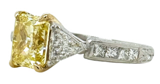 Platinum and 18kt yellow gold trillion and radiant yellow diamond ring