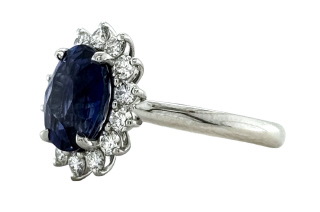 Platinum oval sapphire and diamond halo ring