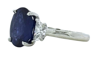 Platinum oval sapphire and half moon diamond ring