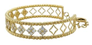 18kt yellow gold felxible diamond cuff bangle with beaded edges and adjustable clasp.