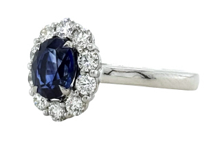 18kt white gold oval sapphire and diamond halo ring.
