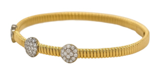 18kt two tone flex bangle bracelet with 3 pave diamond stations and magnetic clasp. 6.25"