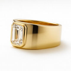 LAB GROWN: 14kt yellow gold wide band with bezel set Lab Grown Emerald Cut Diamond.