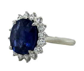 Platinum oval sapphire and diamond halo ring
