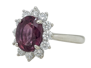Platinum oval purplish-pink sapphire and diamond ring