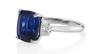 Platinum cushion sapphire and half moon diamond ring