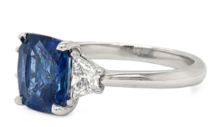 Platinum cushion sapphire and trap diamond ring
