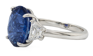 Platinum oval sapphire and traps diamond ring