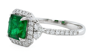 18kt white gold emerald, round and pearshape diamond ring