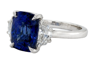 Platinum cushion sapphire and diamond 3 stone ring