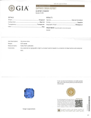 Platinum square emerald cut sapphire and trap diamond three stone ring