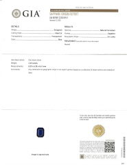 Platinum emerald cut sapphire and traps diamond ring