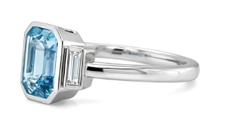 18kt white gold bezel set aqua and diamond 3-stone ring.