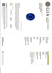 Platinum oval sapphire and diamond halo style ring.