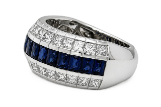 18kt white gold 3-row channel set sapphire and diamond 1/2 way band.