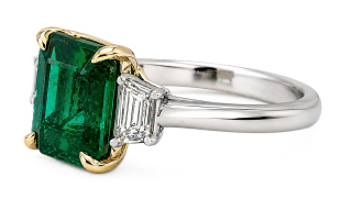 Platinum & 18kt yellow gold emerald and trap diamond ring