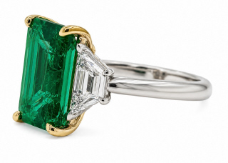 Platinum & 18kt yellow gold emerald cut emerald and trap diamond ring