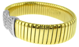 18kt two-tone flexible cuff bangle bracelet with pave diamond ends.