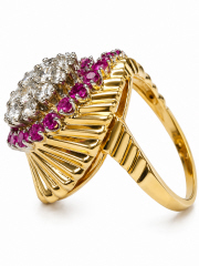 18kt yellow gold ruby and diamond fluted wave style fashion ring.