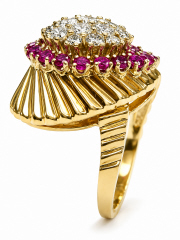18kt yellow gold ruby and diamond fluted wave style fashion ring.