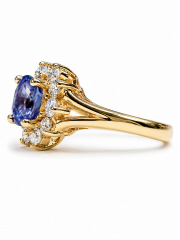 14kt yellow gold, no-heat sapphire and diamond halo style ring.