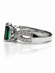 Platinum/18kt white gold emerald and diamond ring.