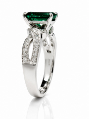 Platinum/18kt white gold emerald and diamond ring.
