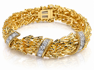 18kt yellow gold David Webb textured gold foliage diamond bracelet.