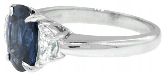 Platinum oval sapphire and half-moon diamonds ring