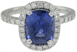 Platinum micro pave diamond ring with cushion sapphire center