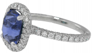 Platinum micro pave diamond ring with cushion sapphire center