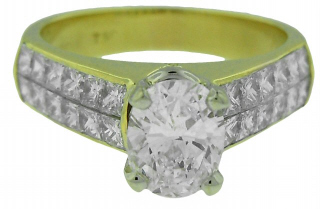 18kt yellow gold princess cut diamond ring with oval center diamond.