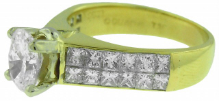18kt yellow gold princess cut diamond ring with oval center diamond.