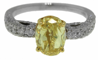 18kt two-tone fancy yellow oval diamond and pave diamond ring