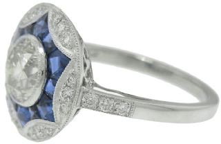 Platinum antique style diamond and sapphire ring