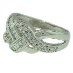 Platinum round and baguette diamond ring